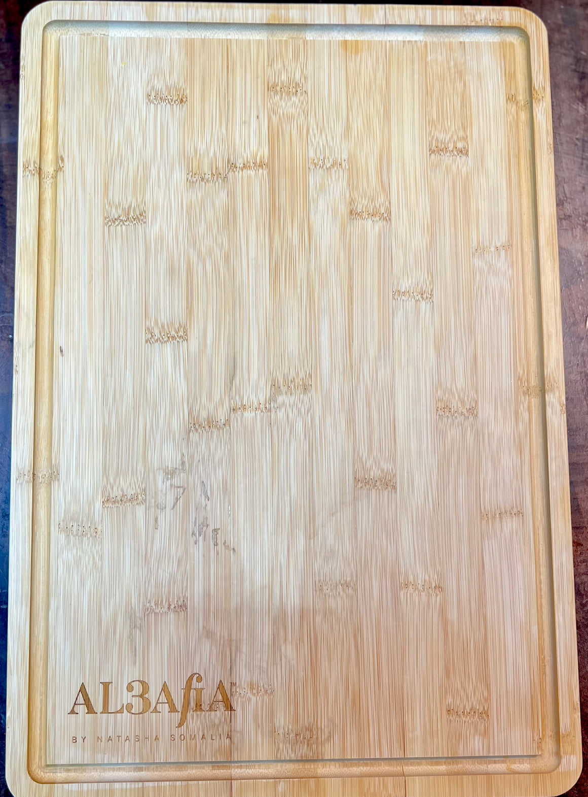 AL3AfiA Signature Bamboo Cutting Board
By Natasha Somalia